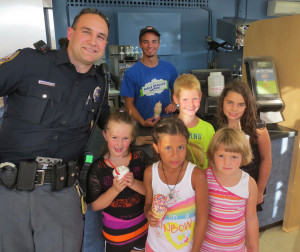 Yorkshire students line up for ice cream in July.  At left is Officer John Shapley of the Springettsbury Township Police Department.