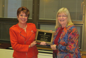 Dr. Kate Orban (left) receives a plaque from Lynne Leopold-Sharp, school board president.  Dr. Orban retired as superintendent of the York Suburban School District in November.