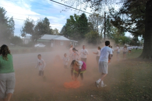 Participants run through a cloud of color corn starch during "Color Clash."  (Photos by Jamie Evans)