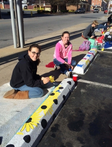 York Suburban students (left to right) Colleen Dommel, Ashleigh Mackin, Gabe Fryar and Sophia Hovis paint parking bumpers.