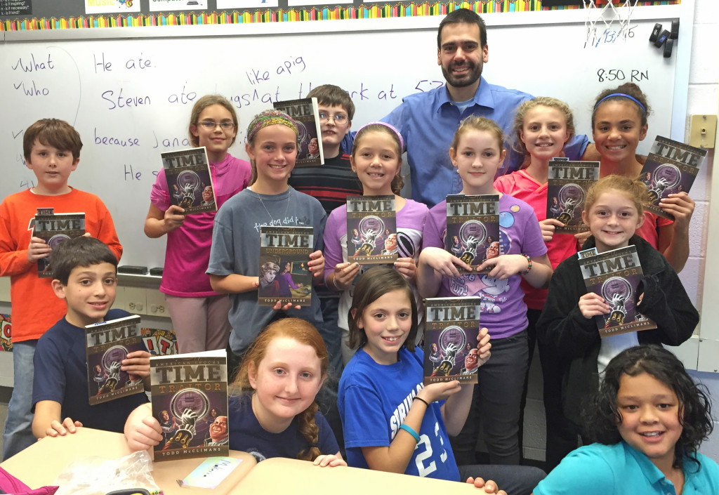 Author Todd McClimans is shown with fifth graders at Indian Rock Elementary School.