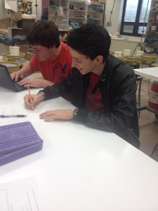 Senior Noel Affolter (right) working hard and having fun in ceramics class.  Photo by Alex Babinchak 