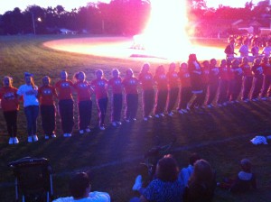 York Suburban varsity and junior varsity cheerleaders get the football boys, students, faculty, and parents hype for the homecoming game at the bonfire. Photo Submitted by Kayla de Garay. 
